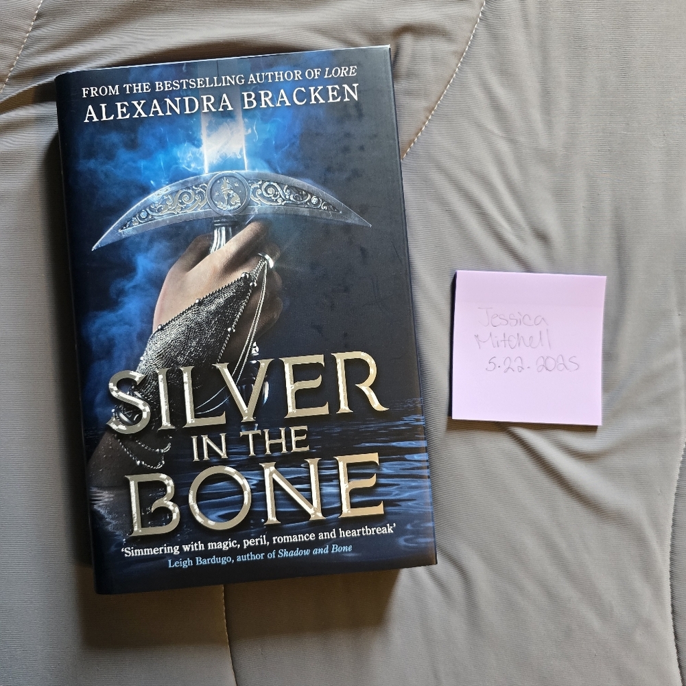 Silver in the Bone by Alexandra Bracken - Black and Blue Cover